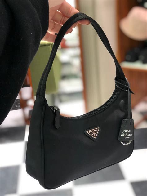 black bag prada|black Prada bag with pouch.